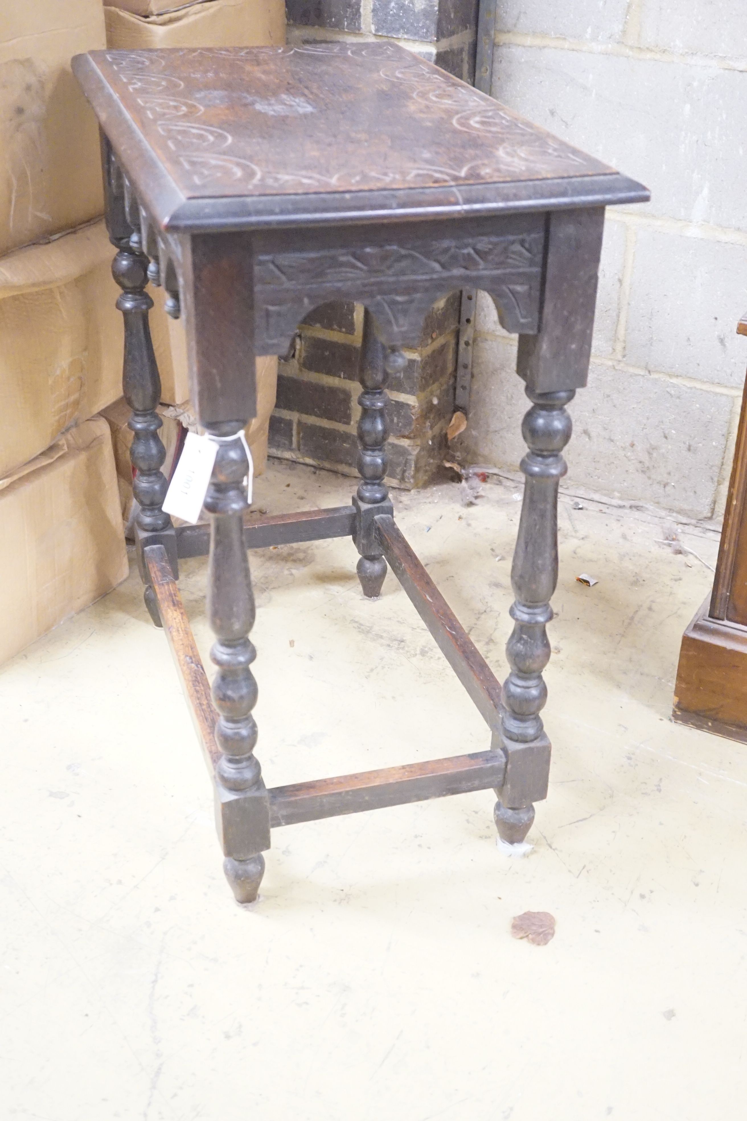 A rectangular carved oak side table, width 66cm depth 40cm height 74cm